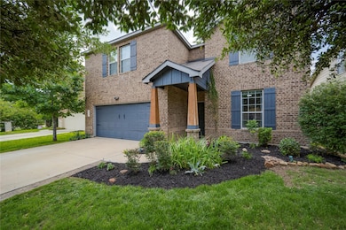 Traditional-style house featuring brick siding, a