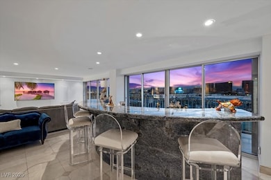 Indoor bar featuring recessed lighting and light tile patterned floors