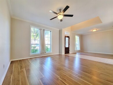 Spare room with crown molding, plenty of natural 