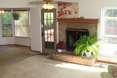 brick woodburning firepl w/ oak mantle