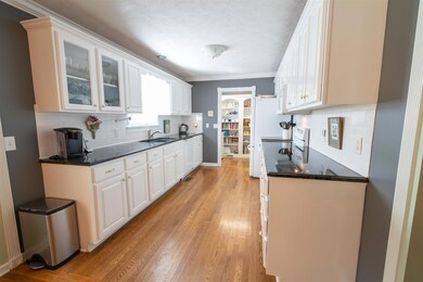 the is kitchen is made for cooking, lots of cabinets with natural lighting and ample counter space.