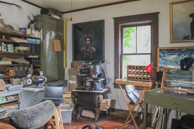 The living area with original hardwoods.