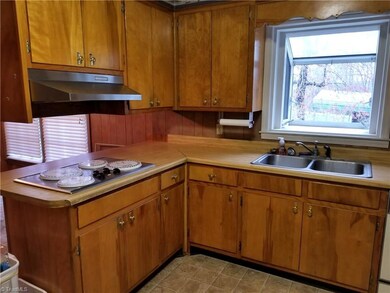 Kitchen with Cooktop, Built In Oven, DW & Refrigerator to Remain. Garden Window box
