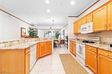 Kitchen featuring light tile patterned flooring, b