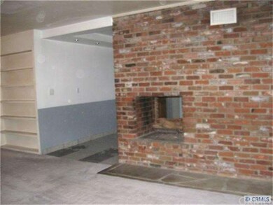 DOUBLE SIDED FIREPLACE BETWEEN THE LIVING ROOM & D