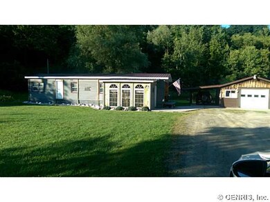 Exterior Front. Driveway and garage.