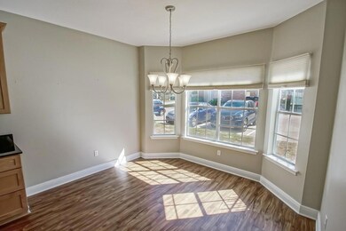 Nice size breakfast area with bay window and custo