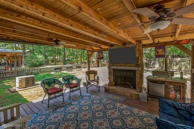 Back covered deck with fireplace