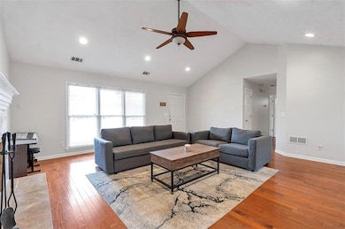 Living area featuring recessed lighting, wood-type