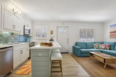 Kitchen featuring stainless steel appliances, back