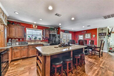 Kitchen with a breakfast bar area, a center island