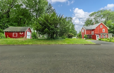 Corner lot-side view of home and garage