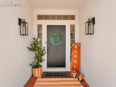 Property entrance featuring stucco siding