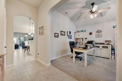 Tiled home office with ceiling fan with notable ch