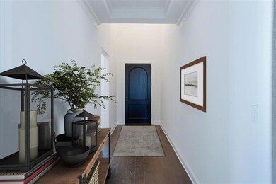 Wood flooring at entry,  virtually staged for demo