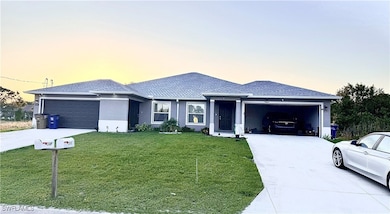 Single story home featuring an attached garage, dr