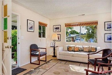 Front door to charming living room.