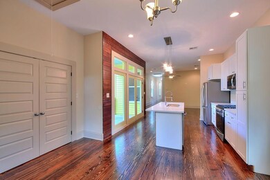 Open Living/Kitchen with hardwood floors throughou
