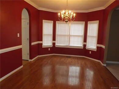 The Dining Room has an open concept with plenty of room for entertaining or large family dinners.  It features hardwood floors, crown molding and chair rail.