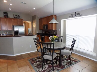 Breakfast dining, spacious kitchen.
