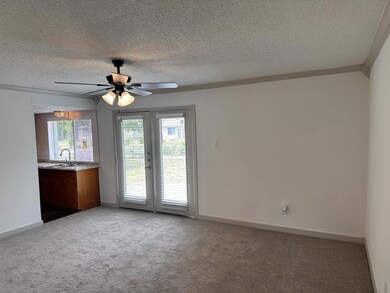 Unfurnished room featuring carpet, ornamental mold