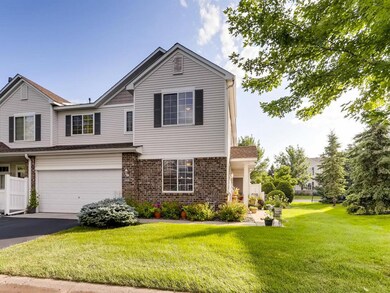 Nice curb appeal with private sidewalk.