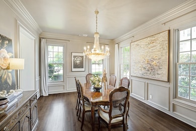 Gracious dining room is ready for hosting large di