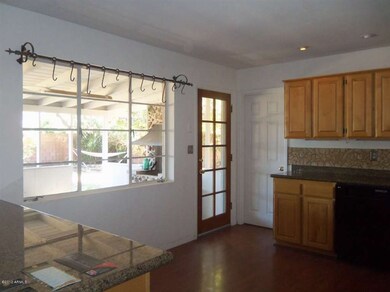View from Kitchen to Back Patio-BBQ