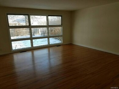 LIVING ROOM- WINDOW WALL & BUILT IN BOOKCASES