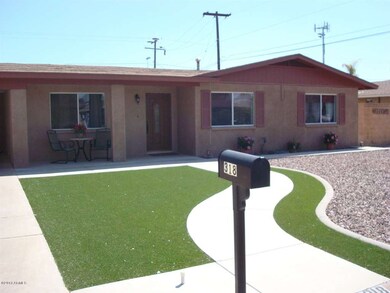 Synthetic grass & gravel front landscapi