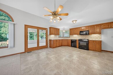 Kitchen and Breakfast Room with Atrium Door open to Screened in Composite Deck