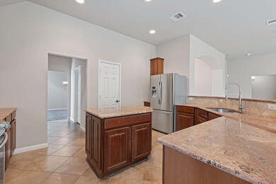 Kitchen featuring appliances with stainless steel