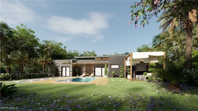 Back of house with an outdoor pool, stucco siding,