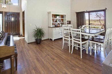 Wood laminate floors, tall ceilings and open conce
