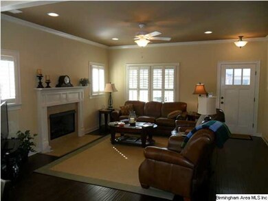 Great room showing fireplace and lots of natural l