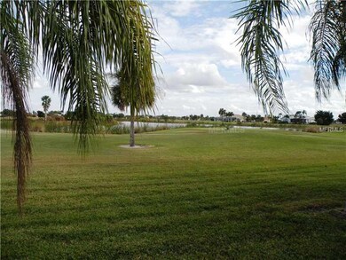 View - Wide expanse of lawns with tropical landscaping, golf course, and preserve.