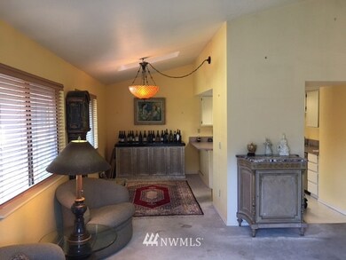 Dining/living room. The wine credenza is of high quality and is included in the sale. (The dining light fixture goes with the Seller).
