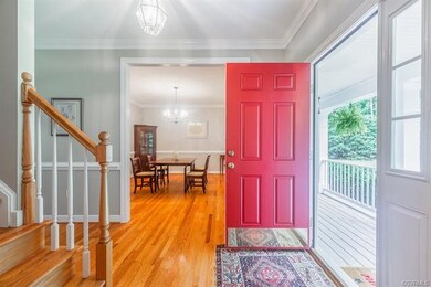 Greet your guests into this spacious foyer and show off your hardwood floors, high ceilings, chair and crown moldings throughout! (P.S. You don't even have to paint before you move in!)