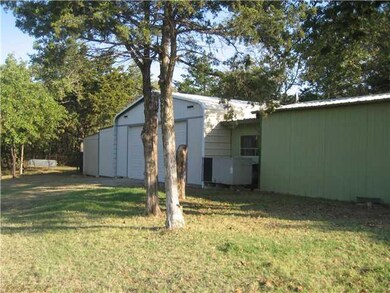 Exterior Front. View of shop building.