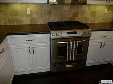 Kitchen with stone back splash