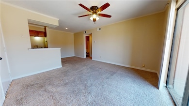 Empty room featuring light colored carpet, ceiling