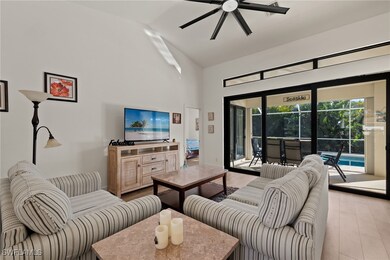 Living room with ceiling fan, light wood-type floo
