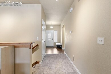 Looking from living room to front door.