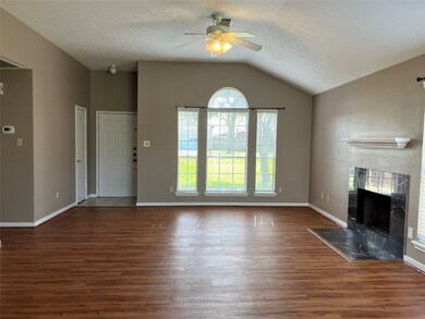 Living room with entry beyond. Large window overlo