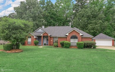 View of front of property with a garage and a fron