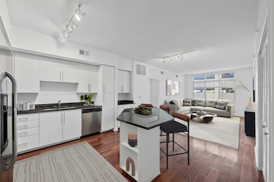 Kitchen with visible vents, dishwasher, a kitchen