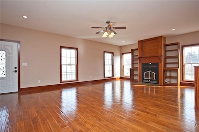 A wood-burning fire place, built in bookcases. A brand new front door.