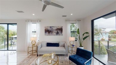 BRIGHT LIVING ROOM WITH COVERED BALCONY