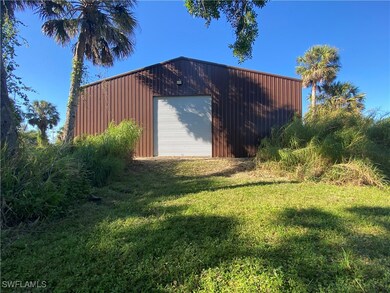View of outdoor structure with an outbuilding