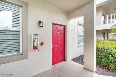 Entrance to property with stucco siding
